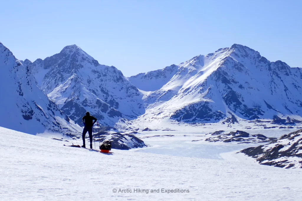 Nordic Ski Touring in East Greenland close to Kulusuk East Greenland. Man becomes small in this magficent winter landscape.
