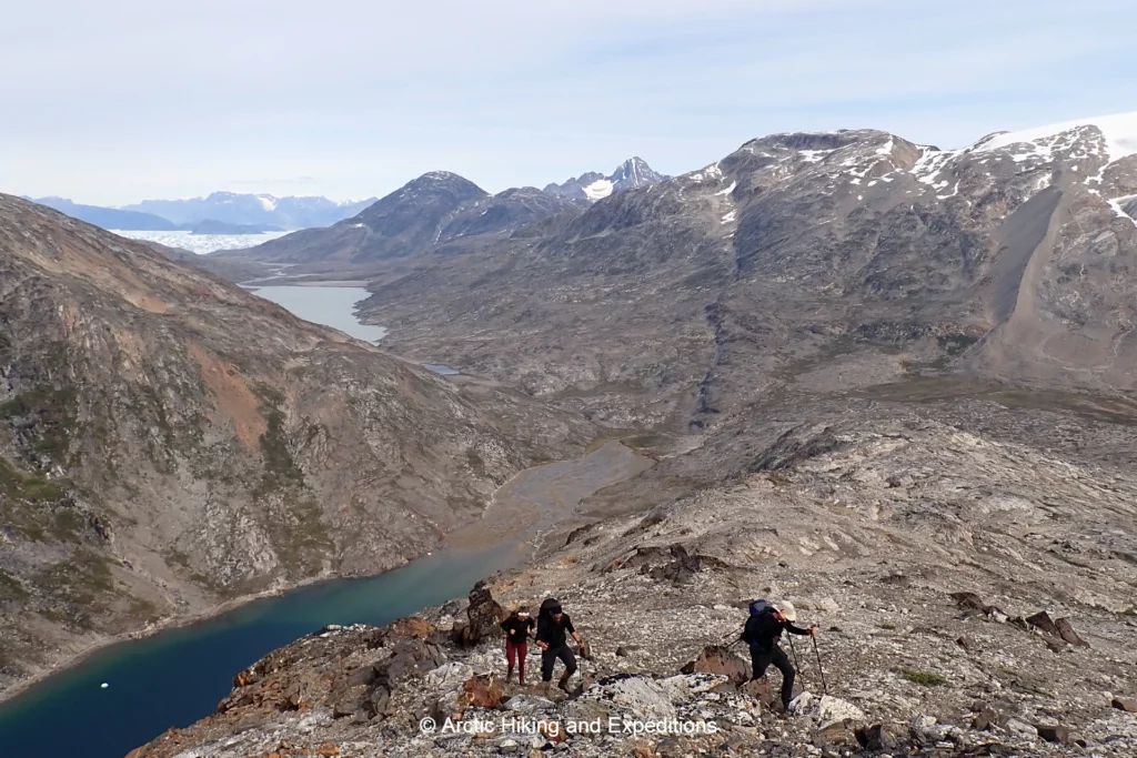 Hikers get magnificent views on the Icefjord trek. Iceberg filled Sermilik fjord, East Greenland, in the distance.