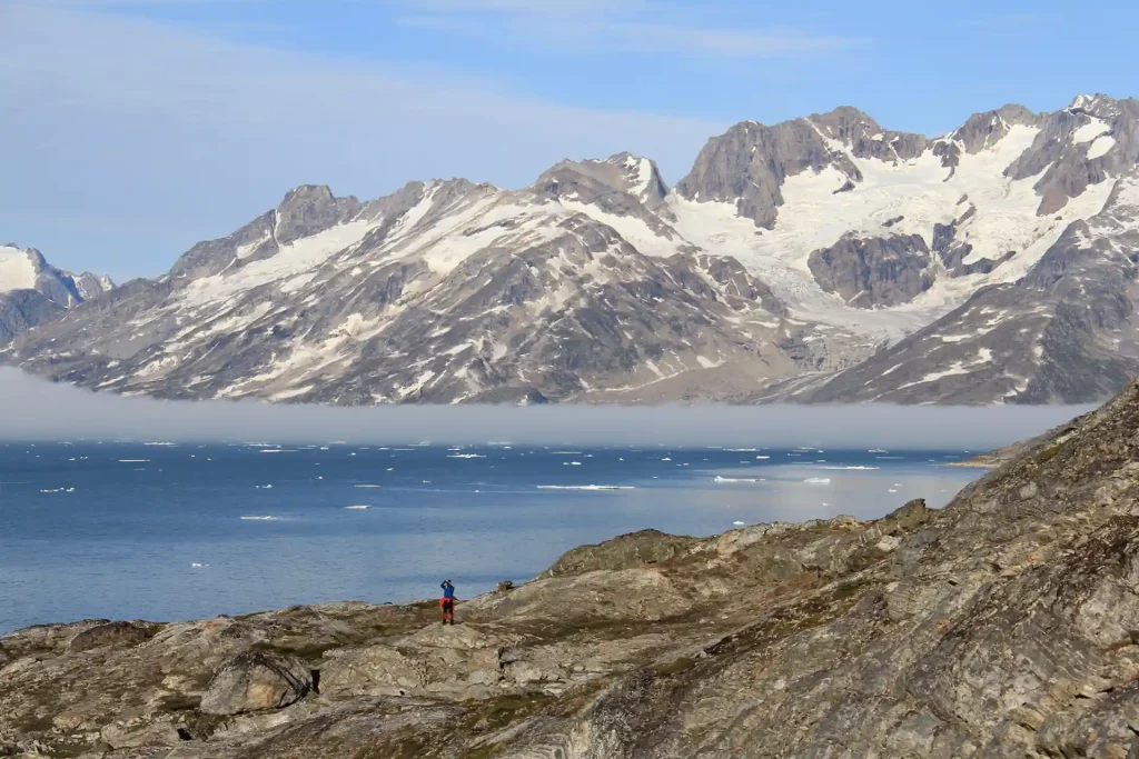 Hikers in Karale Fjord East Greenland.