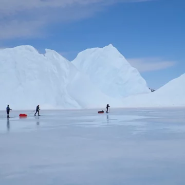 Skiing on the ice close to Kulusuk East Greenland. There is no place like this to have a skiiing adventure.